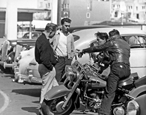 <b class=qtipBold><figcaption>Four Youths In A Parking Lot</figcaption></b><br>San Francisco, California: c. 1955 Four teenagers, two on motorcyles, chat in a parking lot.<br><em>© Underwood Archives/UIG</em> Four Youths In A Parking Lot