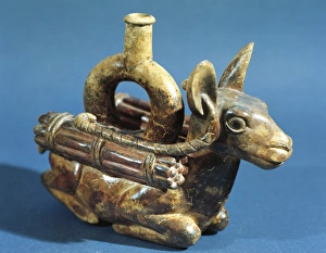 Zoomorphic polychrome terracotta vessel in shape of seated llama with load on its back Zoomorphic polychrome terracotta vessel in shape of seated llama with load on its back