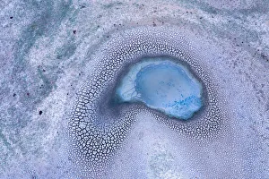 Aerial view of Patterns in the dry cracked soil of drought conditions over farming lands Aerial view of Patterns in the dry cracked soil of drought conditions over farming lands