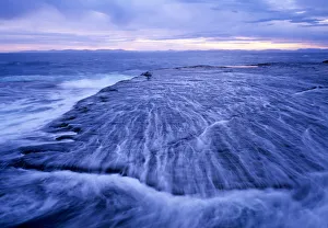 Australia, Tasmania, water washing over wave platforms Australia, Tasmania, water washing over wave platforms