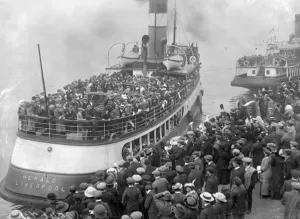 Prints of The tender Herald leaving a Liverpool quay and transporting passengers to the Zealandic, a state emigration ship bound for Australia. (Photo by Topical Press Agency/Getty Images) Liverpool Prints: Mass Emigration Print: Tender Herald at Liverpool Quay