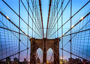 Brooklyn Bridge and Manhattan skyline at dusk under a cloud of fog Brooklyn Bridge and Manhattan skyline at dusk under a cloud of fog