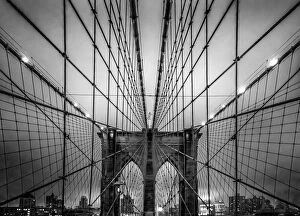 Images Dated 10th May 2014: Brooklyn Bridge and Manhattan skyline at dusk under a cloud of fog in black and white