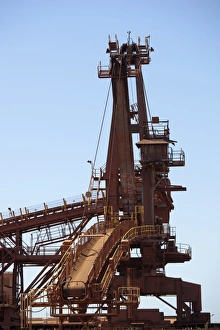 A bucket wheel reclaimer in an iron ore mine A bucket wheel reclaimer in an iron ore mine
