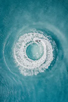 Circle patterns created by jet ski at sea as seen from directly above, Barbados Circle patterns created by jet ski at sea as seen from directly above, Barbados
