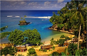 Cluster of tourist beach huts, The Island of Upolu, Western Samoa Cluster of tourist beach huts, The Island of Upolu, Western Samoa