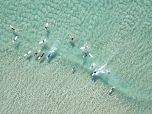 Aerial Views Gallery: crystal clear waters with surfers seen from above
