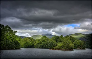 Dappled light over Loch Katrine, in the Trossachs, Scotland Dappled light over Loch Katrine, in the Trossachs, Scotland