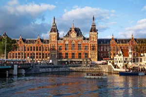 Evening Light Shining on the Station Amsterdam Centraal, Amsterdam, Netherlands Evening Light Shining on the Station Amsterdam Centraal, Amsterdam, Netherlands