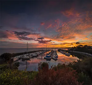 A golden dawn of fiery colours in the late summer, at Newhaven Yacht club marina, Phillip Island Bass Coast, Victoria A golden dawn of fiery colours in the late summer, at Newhaven Yacht club marina, Phillip Island Bass Coast, Victoria