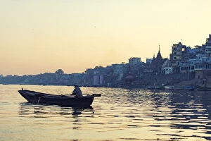 Images Dated 9th February 2013: indian people rowing boat in Ganga river varanasi india