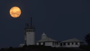 nobbys lighthouse with full moon in newcastle nsw nobbys lighthouse with full moon in newcastle nsw