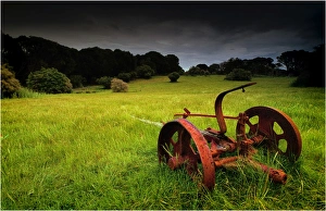 Old farm machinery lays rusting away in a farm paddock near Wybalenna, Flinders Island Tasmania Old farm machinery lays rusting away in a farm paddock near Wybalenna, Flinders Island Tasmania