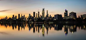 The reflections of the melbourne city skyline at dusk in the still water of albert park The reflections of the melbourne city skyline at dusk in the still water of albert park