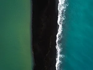 Aerial Views Gallery: River, black beach and ocean, Iceland