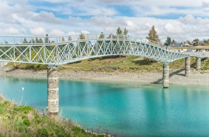 Scenery view of Lake Tekapo footbridge across the stunning water of lake Tekapo in South Scenery view of Lake Tekapo footbridge across the stunning water of lake Tekapo in South