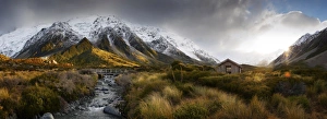 Synshine on snow covered mountains, creek & bridge Synshine on snow covered mountains, creek & bridge