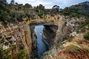 Tasman Arch And Littoral Chasm in Tasman National Park, Tasman Peninsula, Tasmania, Australia Tasman Arch And Littoral Chasm in Tasman National Park, Tasman Peninsula, Tasmania, Australia