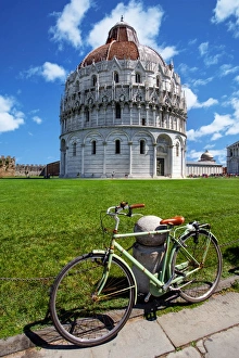 View of Pisa Baptistry With a Bicycle in the Foreground At Piazza dei Miracoli (Piazza del Duomo), Pisa, Tuscany, Italy View of Pisa Baptistry With a Bicycle in the Foreground At Piazza dei Miracoli (Piazza del Duomo), Pisa, Tuscany, Italy