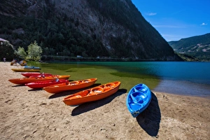 View of Three Valley Lake in Three Valley Gap with a Row of Canoes on the Trans-Canada Highway, British Columbia View of Three Valley Lake in Three Valley Gap with a Row of Canoes on the Trans-Canada Highway, British Columbia