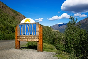 A Yukon Welcome Sign on the Border of Alaska with the Northwest and Dempster Highway A Yukon Welcome Sign on the Border of Alaska with the Northwest and Dempster Highway