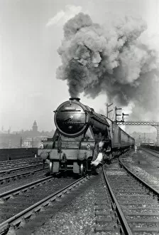 Flying Scotsman A3 Class steam locomotive leaving Leeds station, 1956