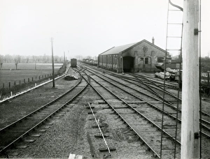 Mildenhall, view west from the station towards goods shed. At right is a signal post Mildenhall, view west from the station towards goods shed. At right is a signal post