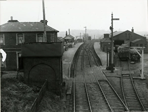 View looking east towards Braintree at Dunmow Station about 1911. Water tank in foreground View looking east towards Braintree at Dunmow Station about 1911. Water tank in foreground