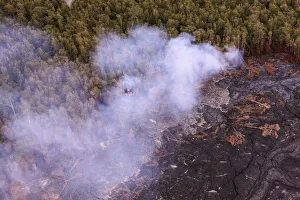 Aerial view of lava from Mauna Loa and burning forest, Big Island, Hawaii, USA Aerial view of lava from Mauna Loa and burning forest, Big Island, Hawaii, USA