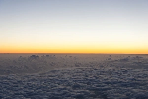 Aerial view, sunrise, red sky over a sea of clouds, La Reunion, Reunion, France Aerial view, sunrise, red sky over a sea of clouds, La Reunion, Reunion, France