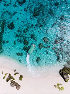 Aerial view of tropical beach and boat on clear water, Kerama Islands, Okinawa, Japan Aerial view of tropical beach and boat on clear water, Kerama Islands, Okinawa, Japan