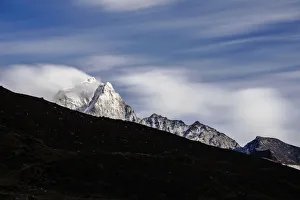 Top of Ama Dablam mountain peak with cloudy movement Top of Ama Dablam mountain peak with cloudy movement