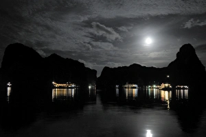 Anchored Junk boats in Halong Bay at night Anchored Junk boats in Halong Bay at night