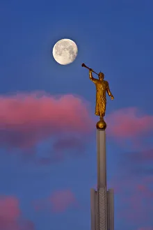 <b class=qtipBold><figcaption>Angel Moroni Blowing a Bubble</figcaption></b><br>The positions of all elements in this image are exactly same as what I saw. I used Planit app to predict this moment. Even before I was physically on the location, I knew what time and where I should put my tripod to capture this moment. The only thing I couldn't predict is clouds. The positions and the colors of clouds were unexpected bonus. This image was made from two continuous shots, one focused on Angel Moroni, the other one focused on the Moon.<br><em>© mei xu</em> Angel Moroni Blowing a Bubble