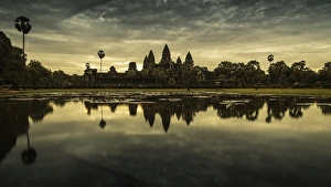 Angkor Wat temple at dawn reflected in water Angkor Wat temple at dawn reflected in water