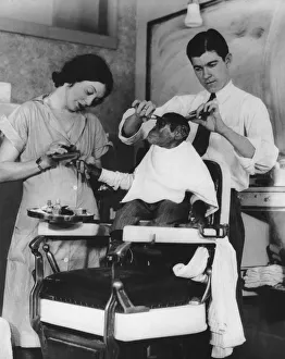 <b class=qtipBold><figcaption>Ape Pampering</figcaption></b><br>A young chimpanzee is given a haircut and manicure, circa 1930. (Photo by FPG/Hulton Archive/Getty Images)<br><em>© 2008 Getty Images</em> Ape Pampering