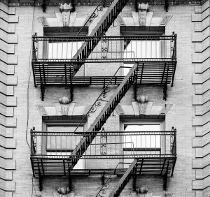 Prints of Pleasing symmetry and balance are the hallmarks of this close up fire escape set up in Manhattan, New York City Architecture Prints: New York City Fire Escape Print: Manhattan Architecture