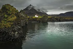 <b class=qtipBold><figcaption>Arnarstapi</figcaption></b><br>A small house sits above the lava cliffs of Arnarstapi, Iceland.<br><em>© 2017 Chase Dekker Wild-Life Images</em> Arnarstapi