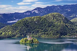 Assumption of Mary Church on an island at Lake Bled, and Julian Alps in background Assumption of Mary Church on an island at Lake Bled, and Julian Alps in background