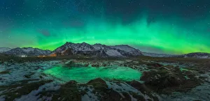 Aurora arch over a mountain range in Iceland Aurora arch over a mountain range in Iceland