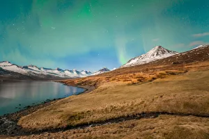 Aurora borealis over the beautiful mountains fjord of Iceland Aurora borealis over the beautiful mountains fjord of Iceland