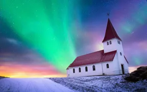 aurora borealis over the church landing on the hill covered by snow, Vik i myrdal church aurora borealis over the church landing on the hill covered by snow, Vik i myrdal church