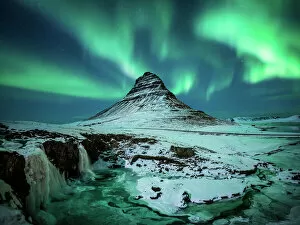 Aurora Borealis Collection: Aurora borealis over Kirkjufell during the night in Iceland