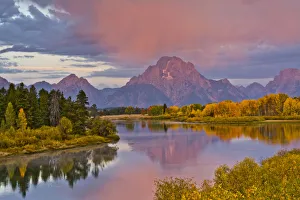 Autumn forests and Mount Moran at sunrise, reflecting in Oxbow Bend of Snake River at Autumn forests and Mount Moran at sunrise, reflecting in Oxbow Bend of Snake River at