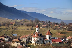 Autumn landscape of village and mountain range in background, Campulung Moldovenesc Autumn landscape of village and mountain range in background, Campulung Moldovenesc