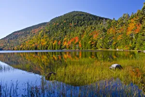 Autumn trees reflecting in Bubble Pond, Acadia National Park, Maine, New England, USA Autumn trees reflecting in Bubble Pond, Acadia National Park, Maine, New England, USA