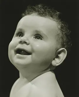 Baby (6-9 months) posing in studio, (B&W), portrait Baby (6-9 months) posing in studio, (B&W), portrait