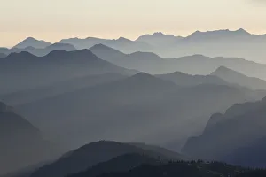 Backlit mountain ridges seen from Hochiss Mountain in Rofan, Maurach, Tyrol, Austria Backlit mountain ridges seen from Hochiss Mountain in Rofan, Maurach, Tyrol, Austria