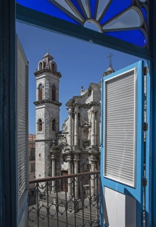 Balcony doors overlooking cityscape, Havana, Cuba Balcony doors overlooking cityscape, Havana, Cuba