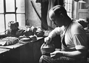 <b class=qtipBold><figcaption>Ball Workshop</figcaption></b><br>circa 1930: Strips of leather being sewn together to make netballs. (Photo by Hulton Archive/Getty Images) Ball Workshop